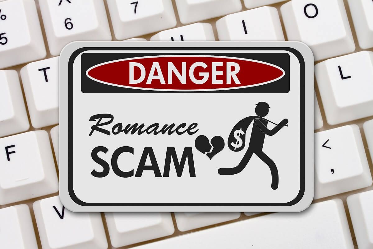 Romance and Dating Scams - Romance Scam danger sign, A black and white danger sign with text Romance Scam and theft icon on a keyboard 3D Illustration