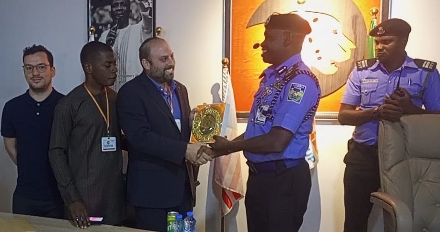 CNC Intelligence's CEO and Co-Founder Receiving a Plaque of Honor from the Nigeria Police